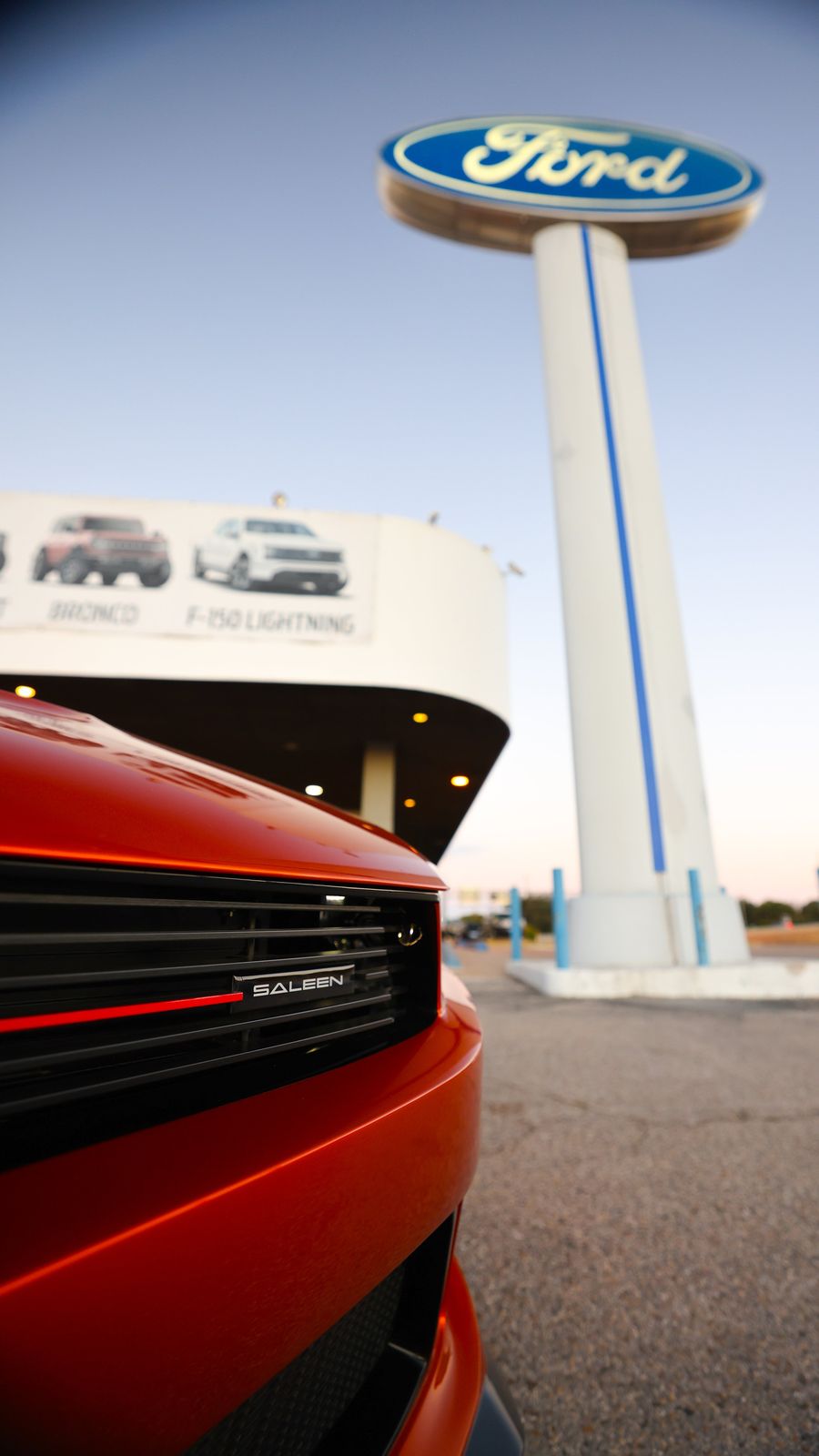 Close-up of a red Saleen sports car with a black grille